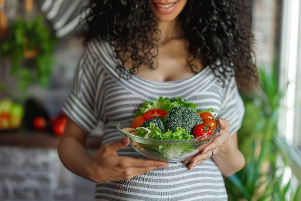 Pregnant woman eating healthy food adult bowl accessories. AI generated Image by rawpixel.