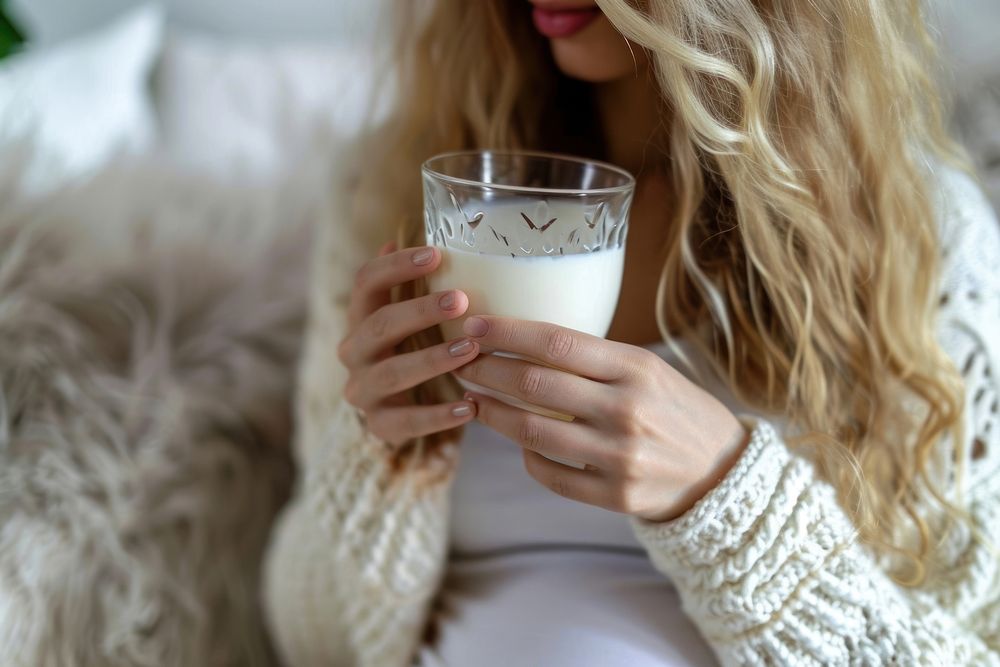 Woman drinking milk during her pregnancy refreshment hairstyle milkshake. AI generated Image by rawpixel.