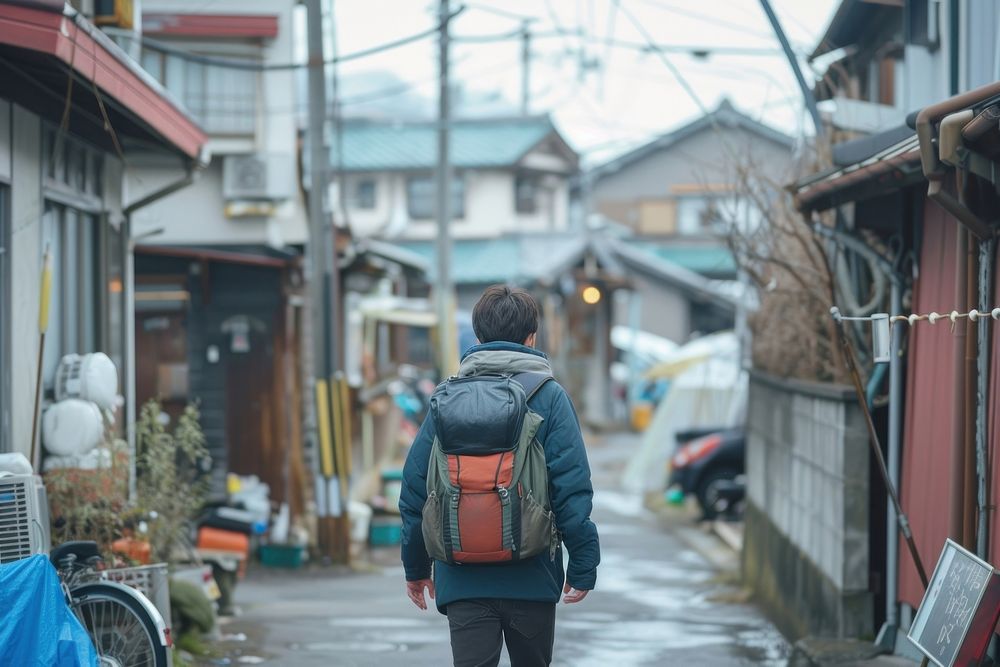 Japan teenage backpack walking street.