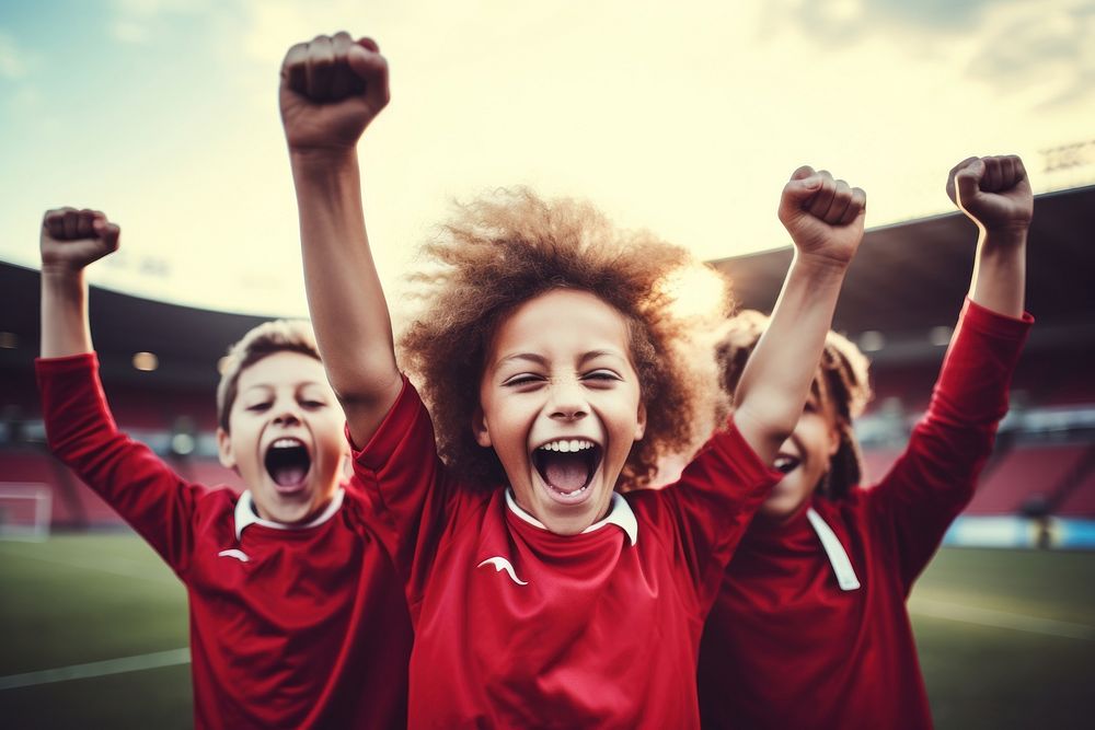 Cheerful team of boys soccer players shouting cheerful stadium. AI generated Image by rawpixel.