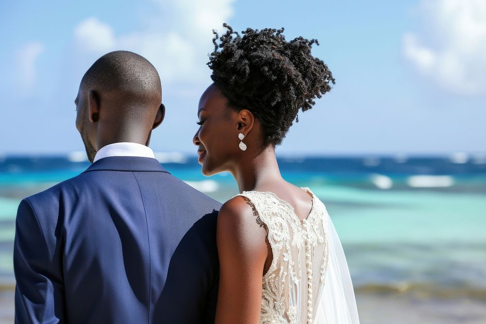 Happy black couple getting married at an island wedding adult bride.