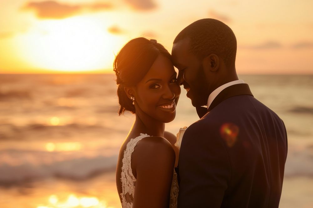 Happy black Groom and Bride at an beach outdoors portrait wedding.