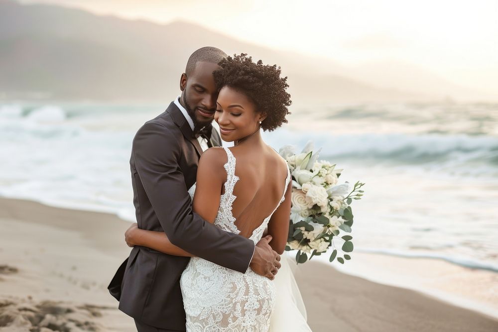 Happy black Groom and Bride at an beach bride outdoors portrait.