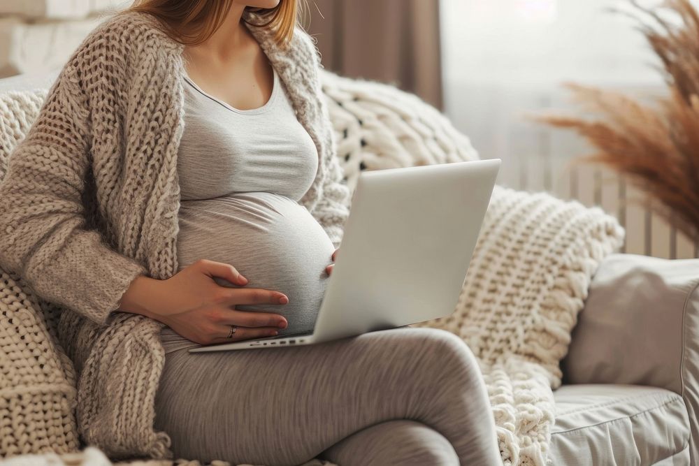 Pregnant woman with laptop computer sitting anticipation. AI generated Image by rawpixel.