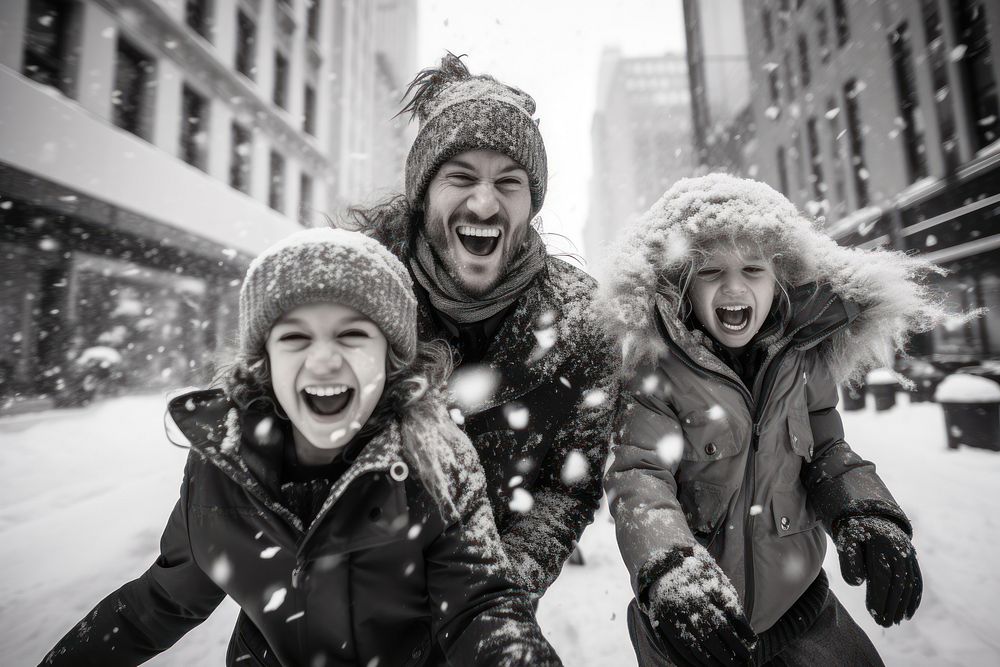 Happy family in snow winter in new york photography laughing portrait.