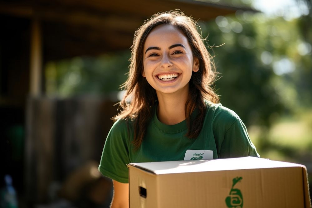 Smiling volunteer girl box cardboard smile.