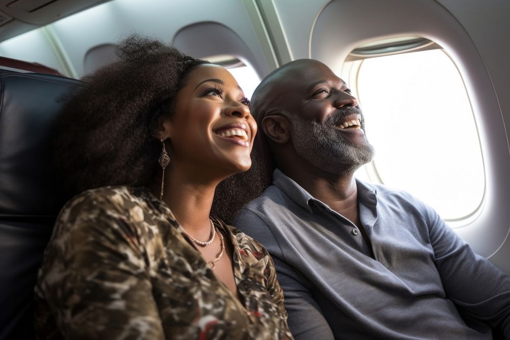 Middle age african american couple portrait airplane looking.