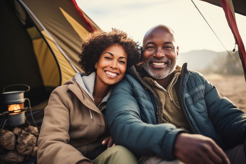Middle age african american couple outdoors portrait camping.