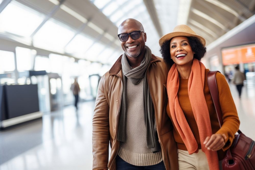 Middle age african american couple traveller airport walking scarf.
