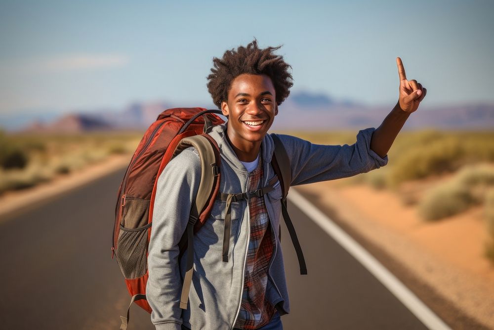 African American teen man travel desert day.