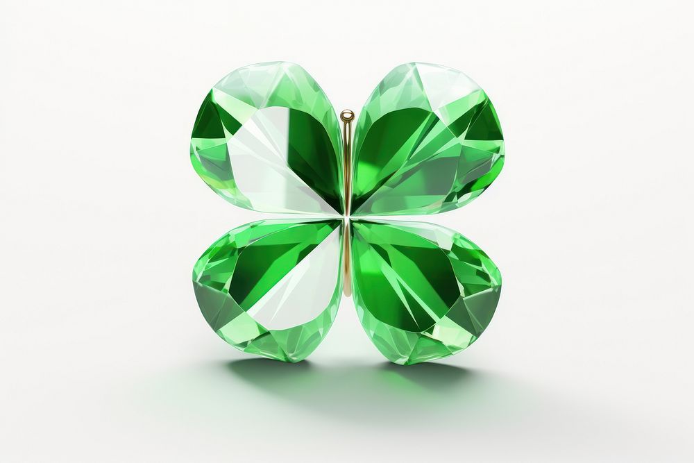 Clover leaf shape gemstone jewelry emerald white background.