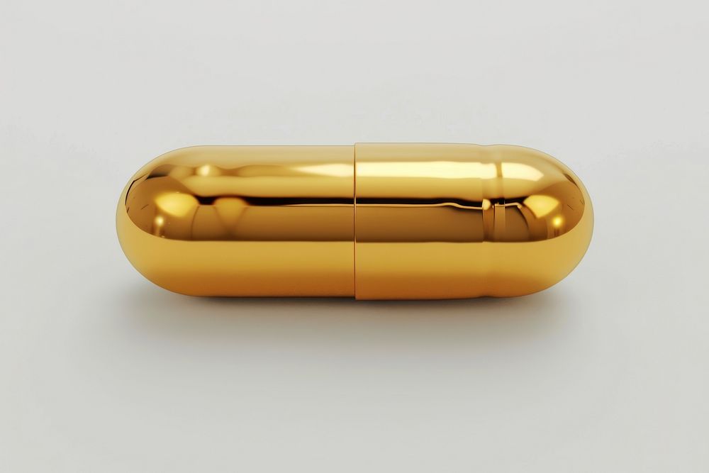 Capsule pill gold white background.