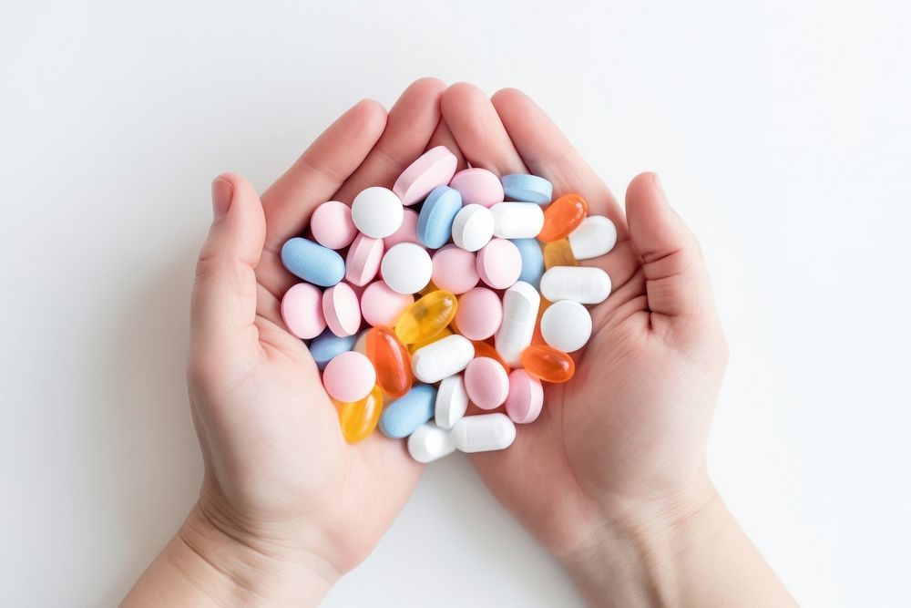 Pills hand antioxidant medication. AI generated Image by rawpixel.