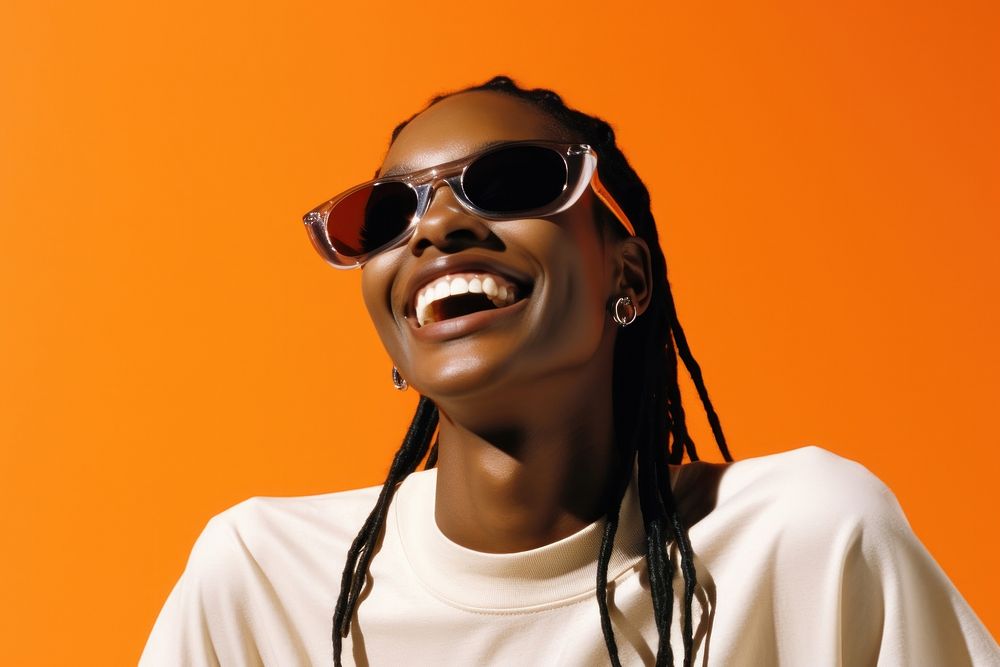 Black young woman smiling wearing a white sunglasses exposing her eyes smile laughing fashion.