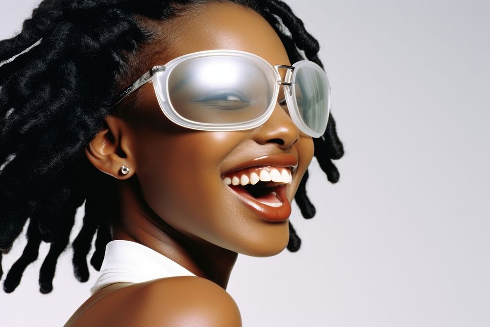 Black young woman smiling wearing a white sunglasses exposing her eyes smile portrait fashion.