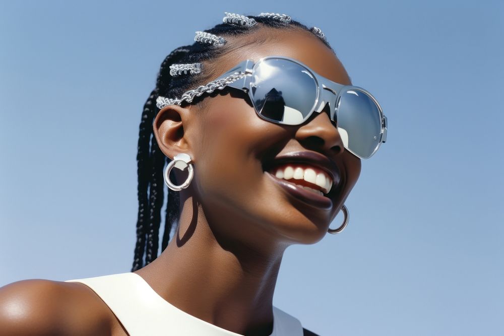 Black young woman smiling wearing a white sunglasses exposing her eyes smile fashion adult.