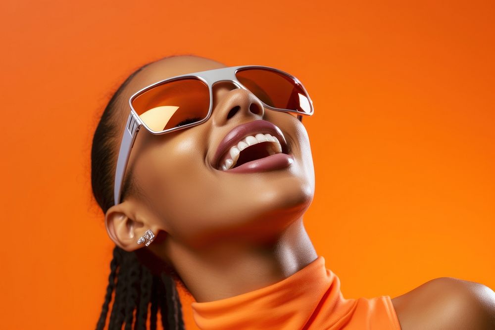 Black young woman smiling wearing a white sunglasses exposing her eyes laughing fashion smile.