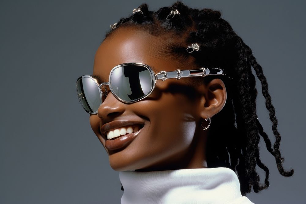 Black young woman smiling wearing a white sunglasses fashion smile accessories.