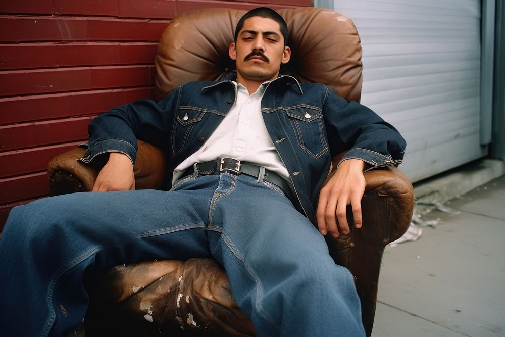 Mexican man sitting chair jeans furniture armchair.