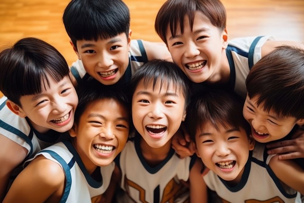 East Asian kids basketball players cheerful laughing child.