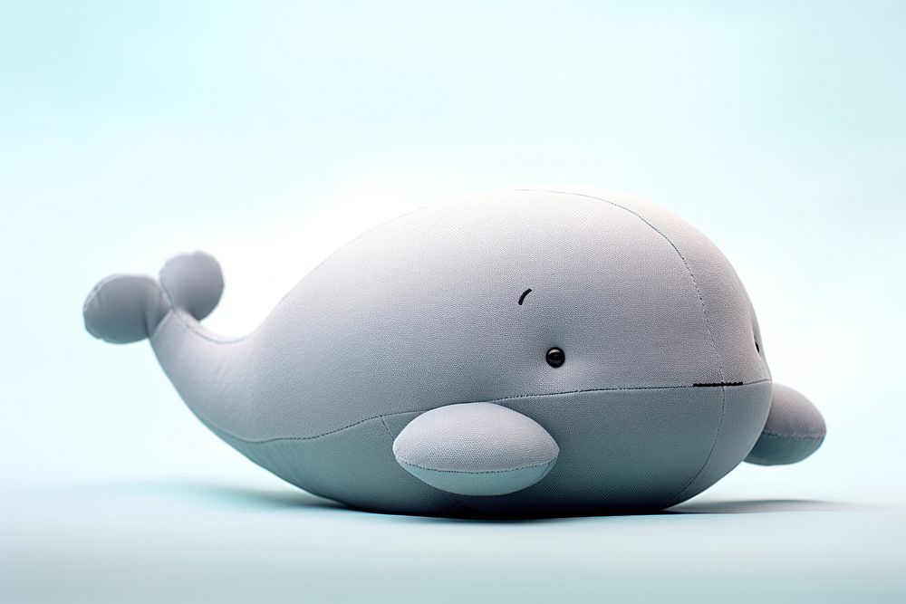 Stuffed doll whale toy representation investment.