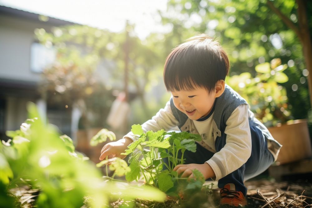 East Asians Chinese kid garden gardening outdoors.