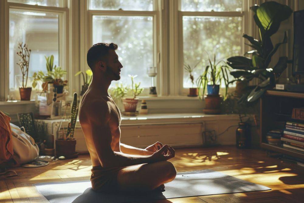Man doing yoga sports adult home.