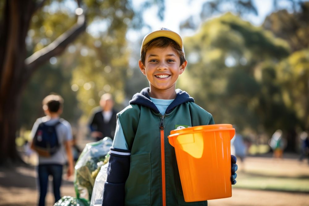 Kids volunteer holding recycling basket smile adult child.