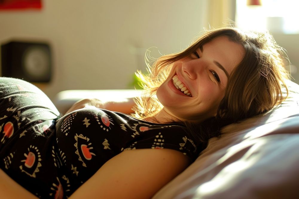 Pregnant british woman laughing portrait smiling.