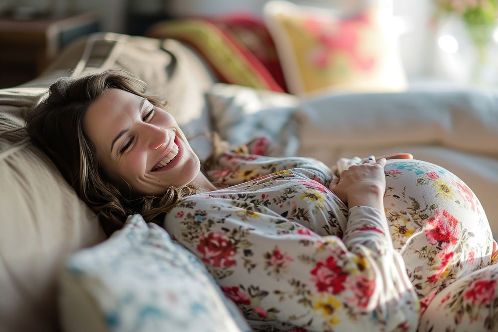 Pregnant british woman smiling blanket smile.