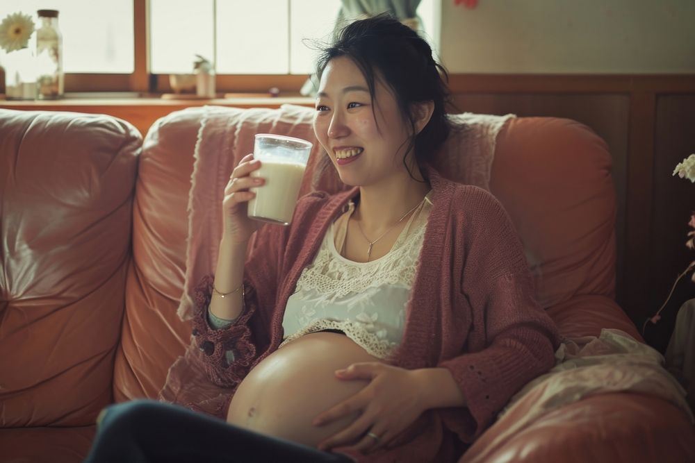 Pregnant korean woman drink furniture drinking.