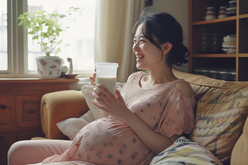 Pregnant korean woman drink furniture drinking.