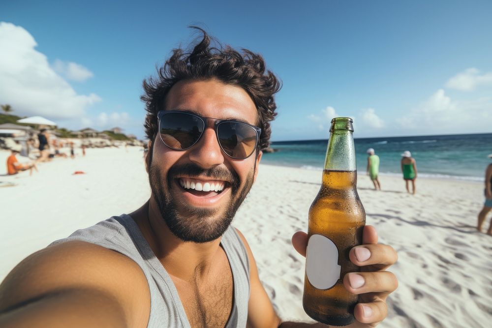 Selfie Latino man holding a beer bottle on a beach portrait relaxation sunglasses. AI generated Image by rawpixel.