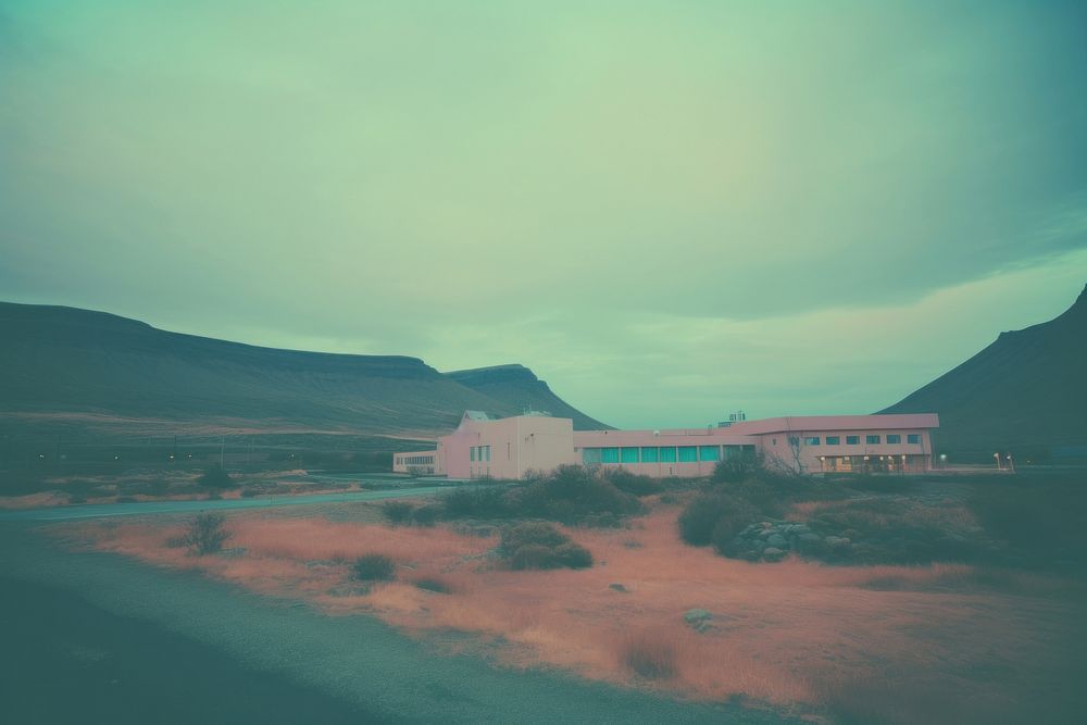  A hospital in a remote location in Iceland background outdoors nature sky. AI generated Image by rawpixel.