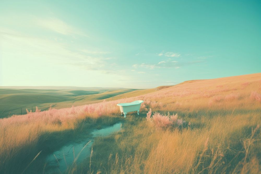  A Aerial view of A tub amidst tall grass on a hill in the middle of a tall grassy background landscape outdoors nature. 