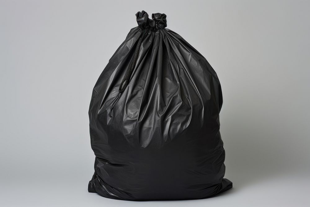 Black garbage bag plastic white background clothing.