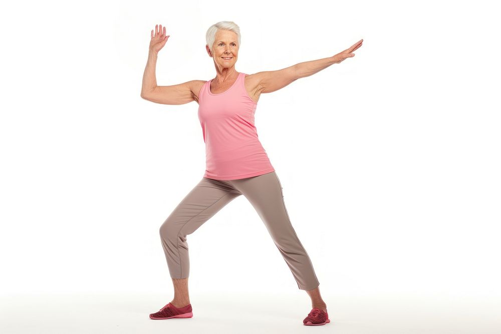 Senior british woman stretching standing exercise.