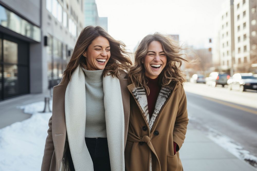 Two happy women taking a walk in the city laughing winter scarf. AI generated Image by rawpixel.