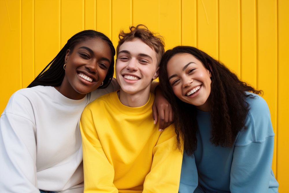 3 inclusivity teenage laughing yellow smile. AI generated Image by rawpixel.