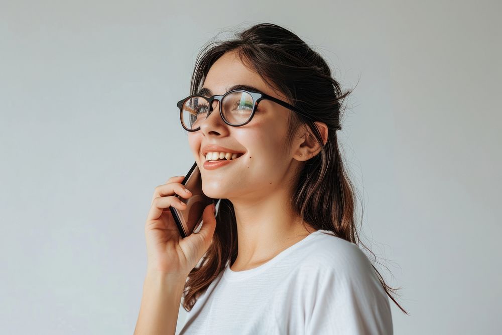 Woman making phone call glasses smile contemplation. AI generated Image by rawpixel.