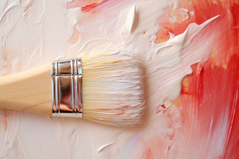 Close up of tip of paint brush on blank canvas backgrounds paintbrush cosmetics.