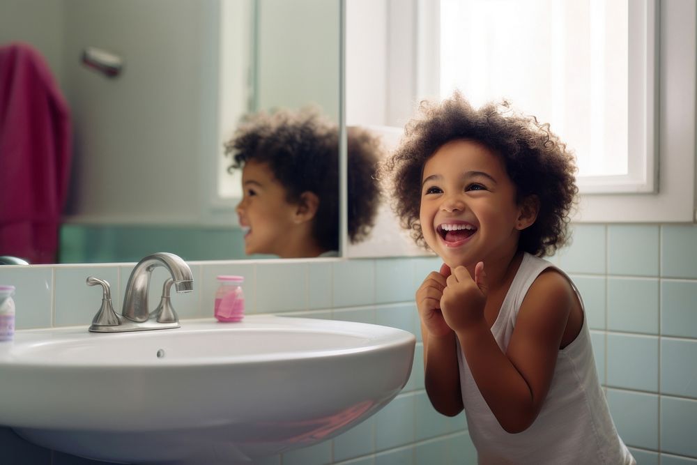 Mixed race bathroom mirror child.