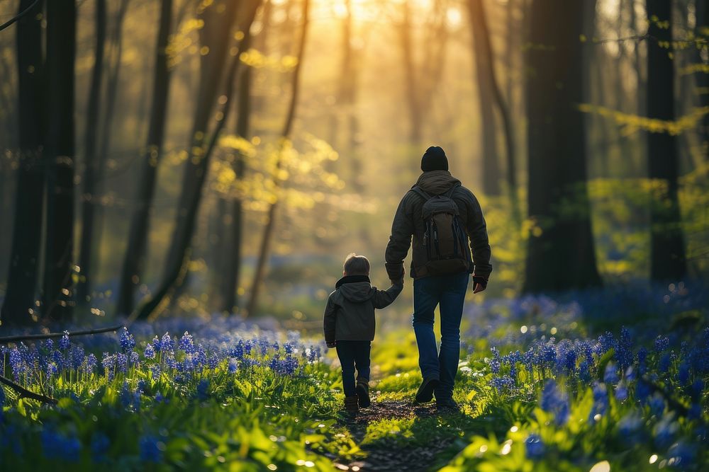 Father and son walking in the forest nature photography outdoors.
