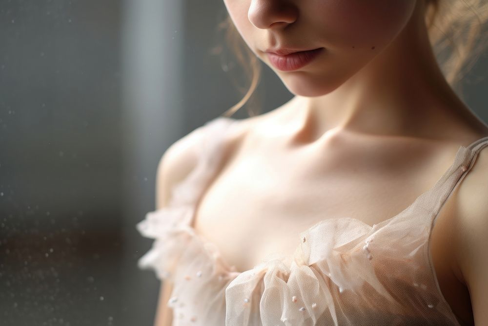 Extreme close up of little ballet dress contemplation hairstyle.