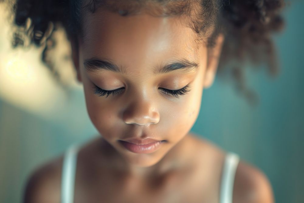 Extreme close up of little black girl ballet child skin contemplation.