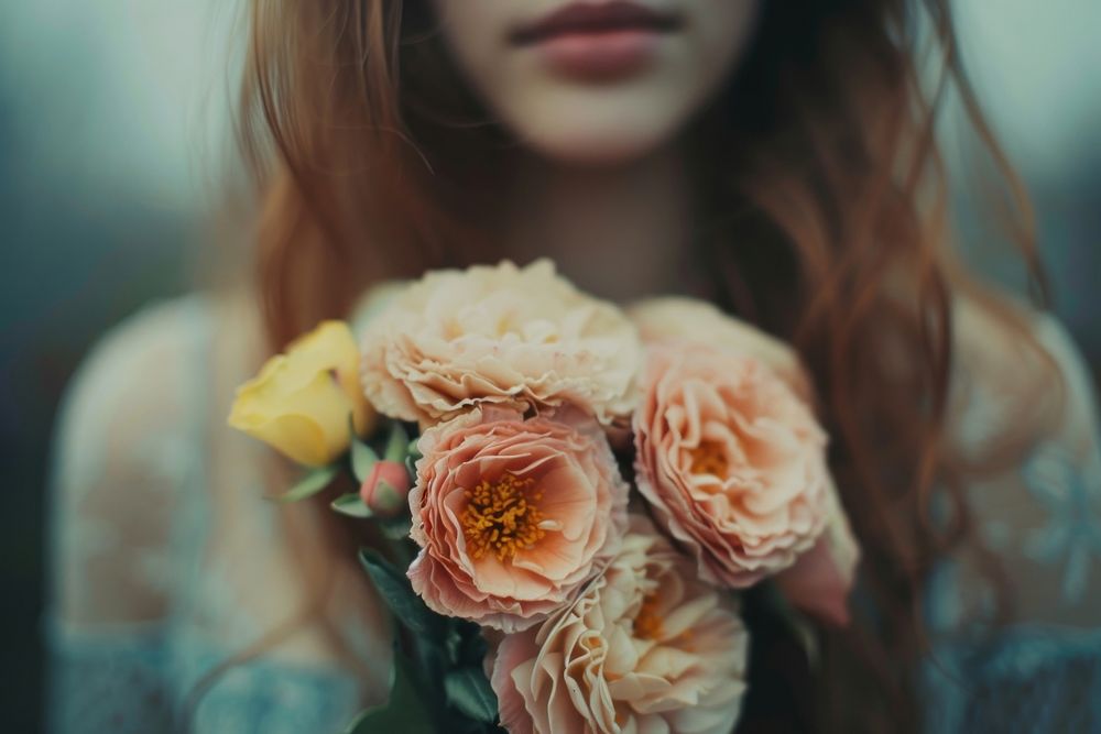 Extreme close up of person holding flowers plant petal rose.