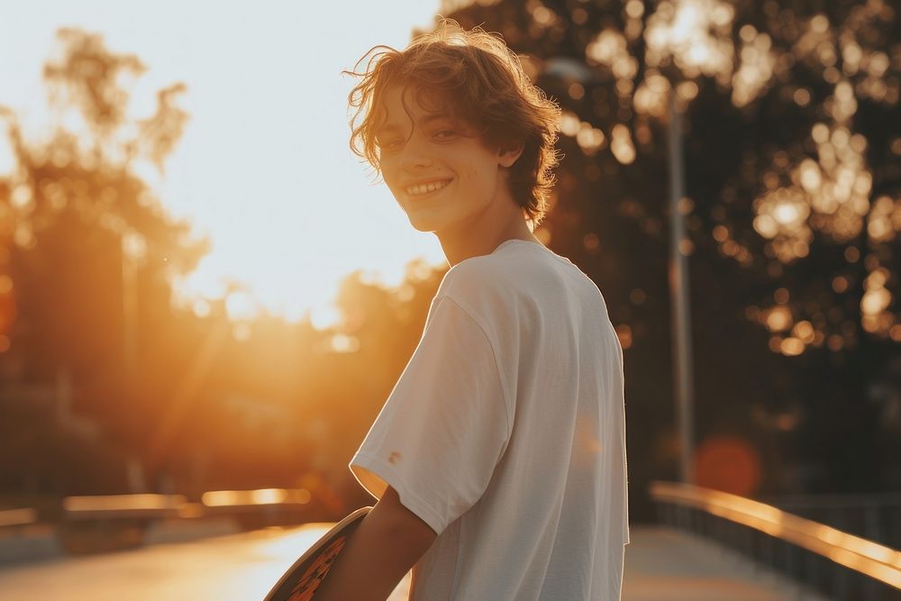 Teen man playing sketeboard person smile day.