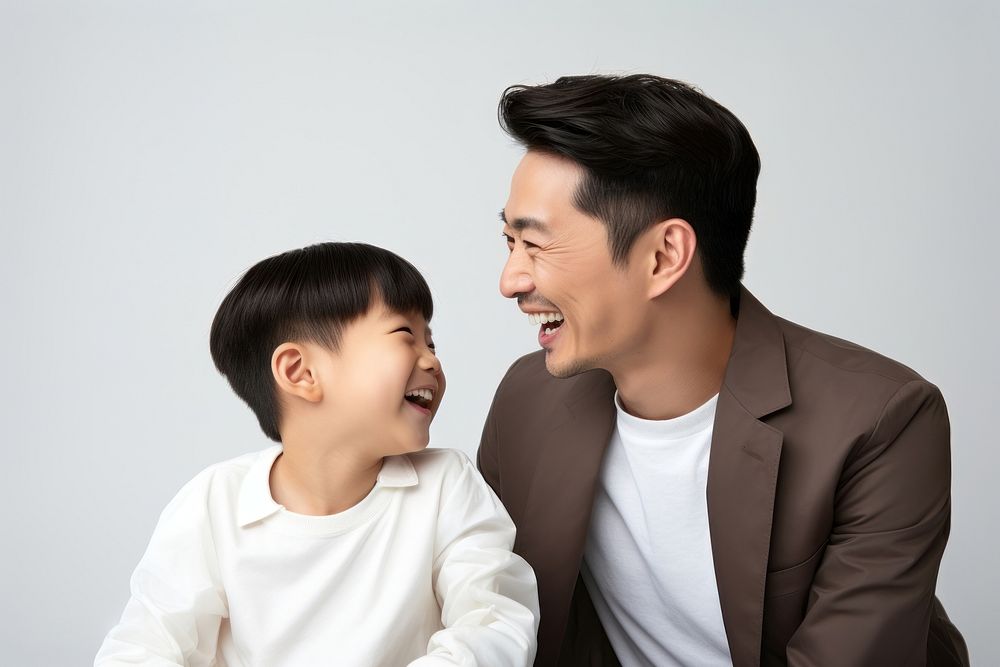 Asian happy father and son child laughing adult togetherness.
