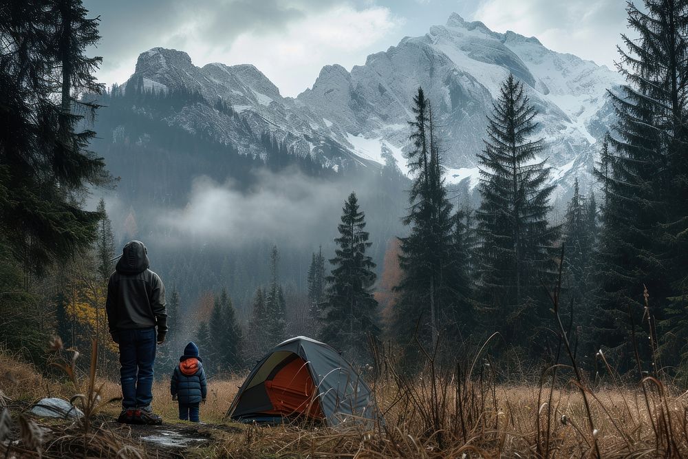 Father and son camping in the forest nature mountain outdoors.