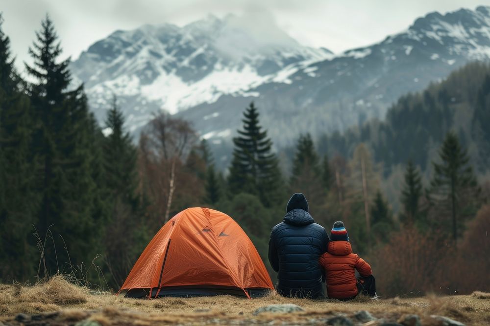 Father and son camping in the forest nature mountain outdoors.